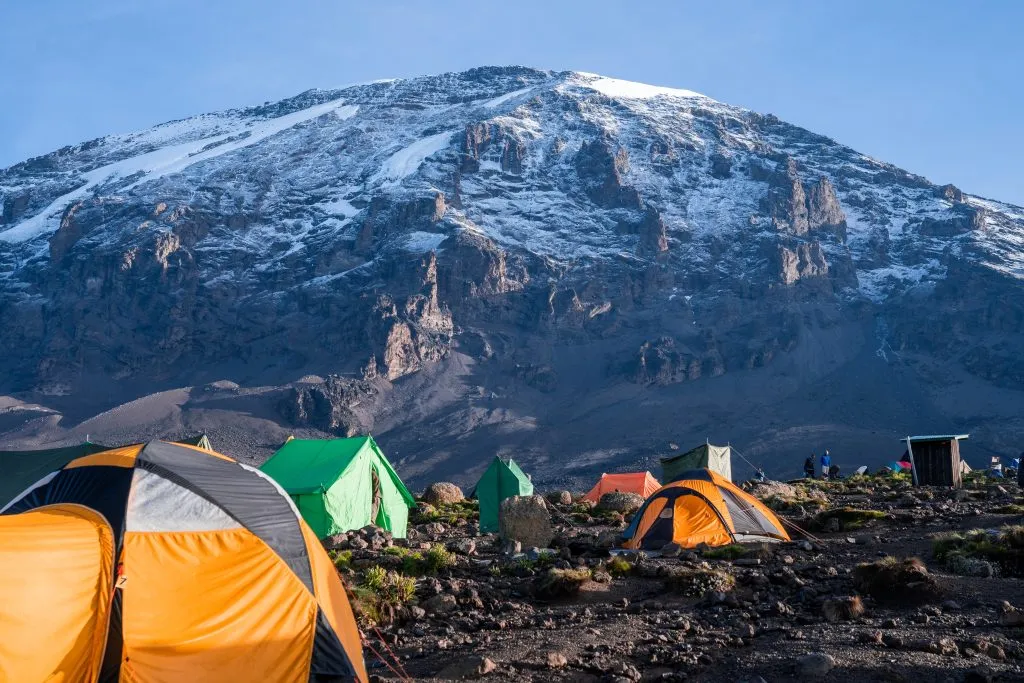 Camping on mount Kilimanjaro in tents to see the glaciers in Tanzania, Africa