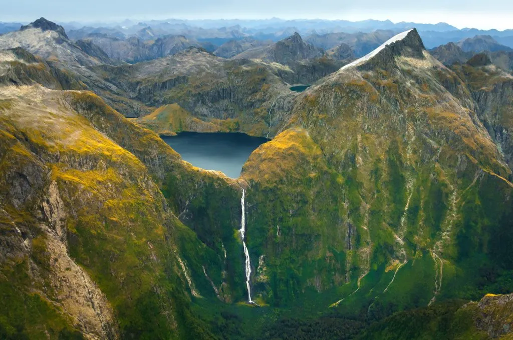 Amazing aerial view of mountain Lake Quill and Sutherland Falls on the scenic flight from Milford Sound to Queenstown, Fiordland, New Zealand